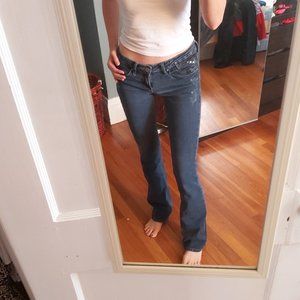 Size 3 Vintage 2000s Blue jeans low rise boot fit with ruffling detail .